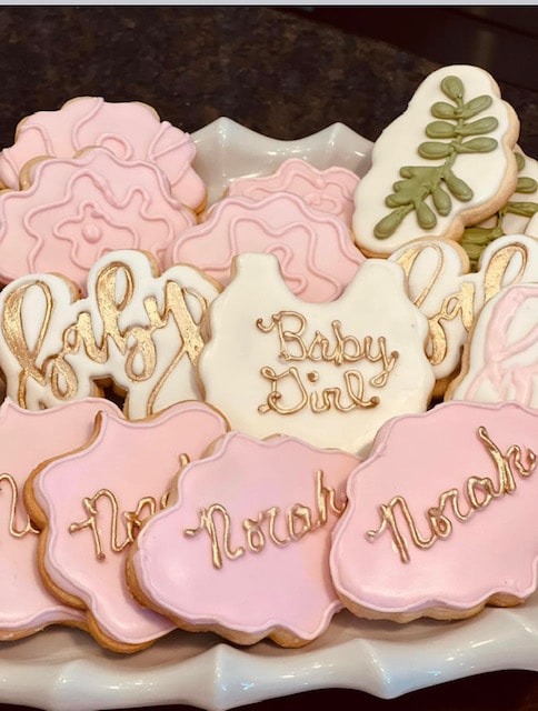 Locally grown themed cookies on a plate — mason jar and vegetable designs with carrots, radishes and greens