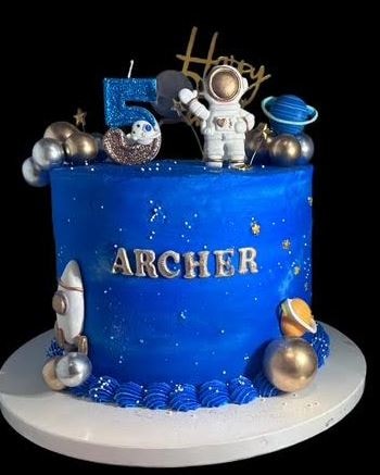 Space astronaut birthday cake for Archer with planets and rocket
