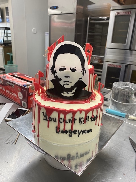 Michael Myers horror themed cake with red drip and You Can't Kill the Boogeyman text