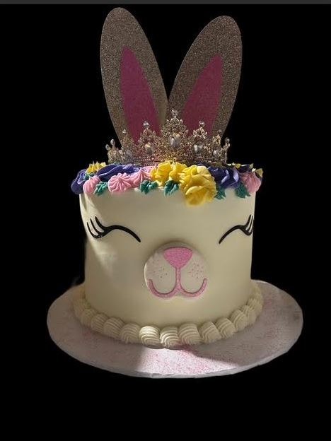 Princess Easter Bunny cake with bunny face, floral crown, and glitter ears