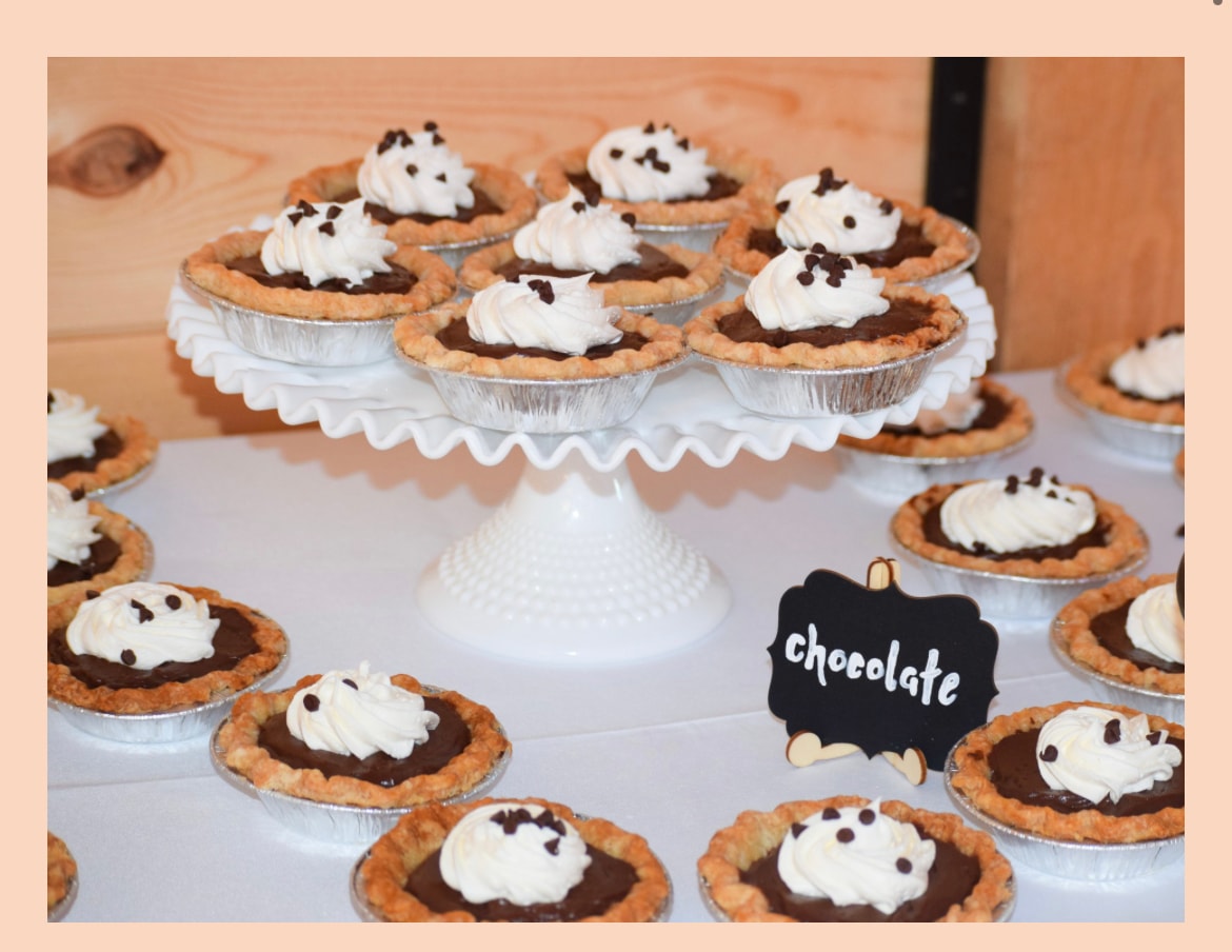 Chocolate tarts with whipped cream and chocolate chips