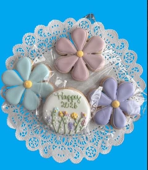 Decorated cookies with flowers and lace doily