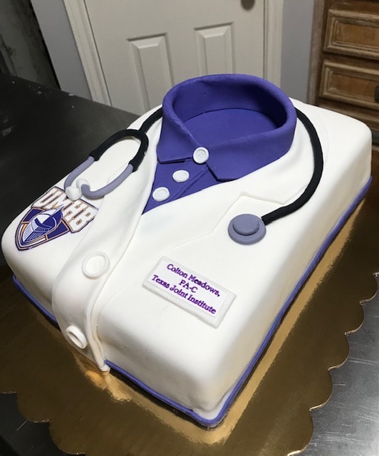 UMHB medical scrubs and stethoscope cake for Colton Meadows PA-C