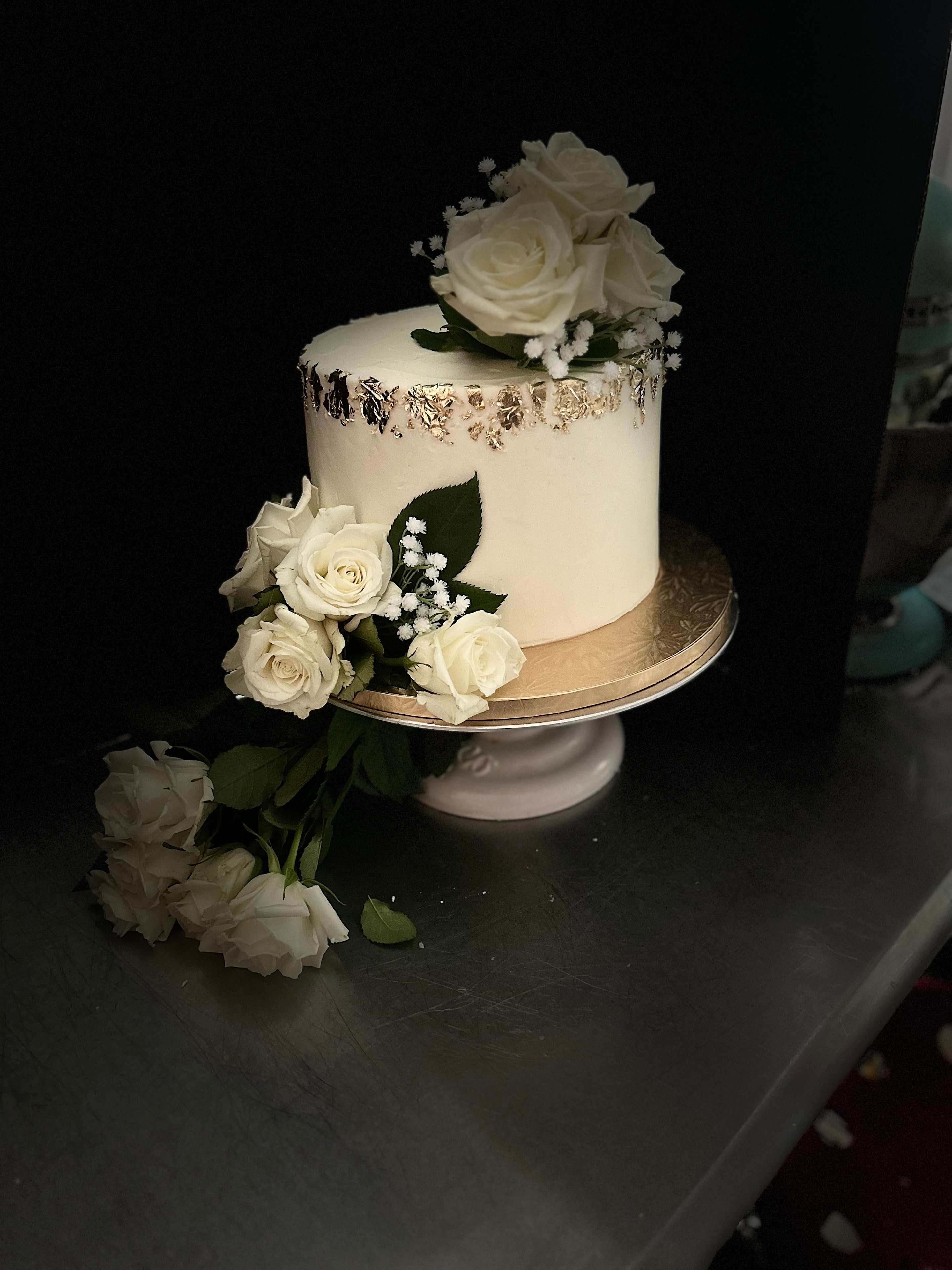 Yellow rose cake with blue flowers and blueberries