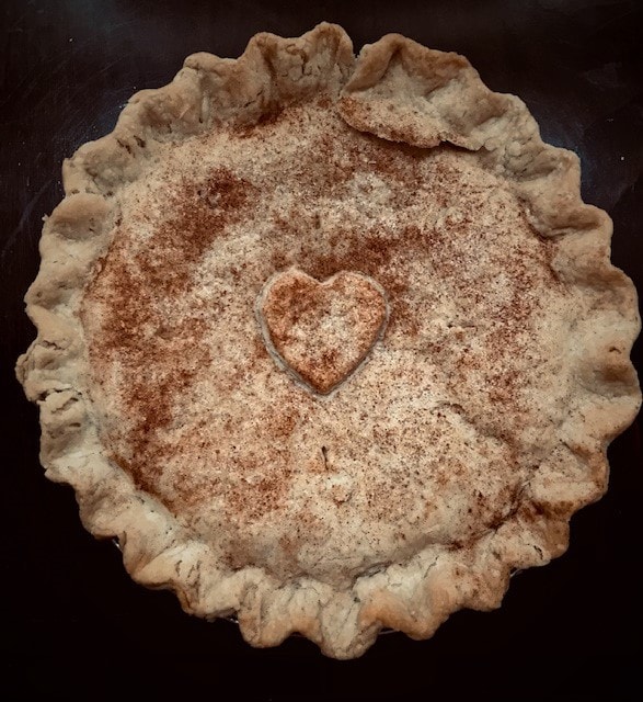 Cinnamon pie with heart decoration