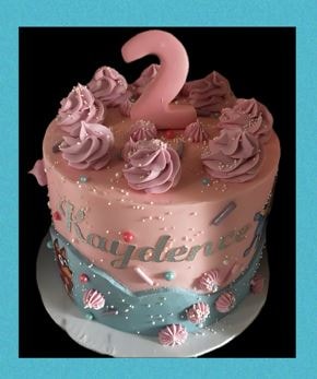 Number 100 cake with blue flowers