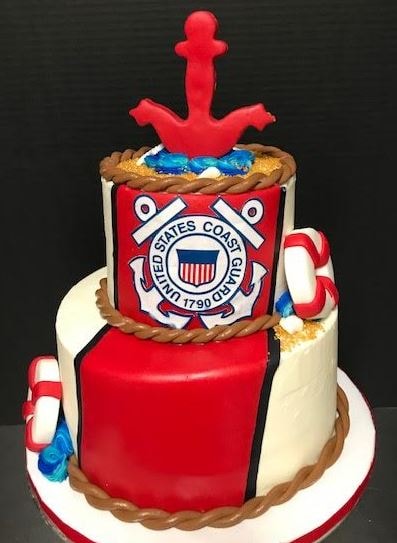 United States Coast Guard themed tiered cake with anchor topper