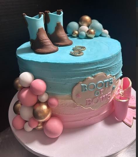 Boots or Bows gender reveal cake in blue and pink