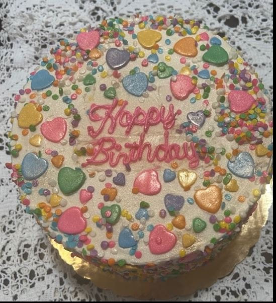 Happy Birthday cake with colorful sprinkle hearts