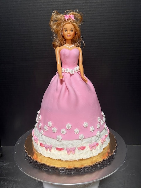Barbie doll birthday cake with pink fondant gown