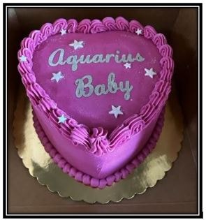 Aquarius Baby heart-shaped purple cake with star decorations
