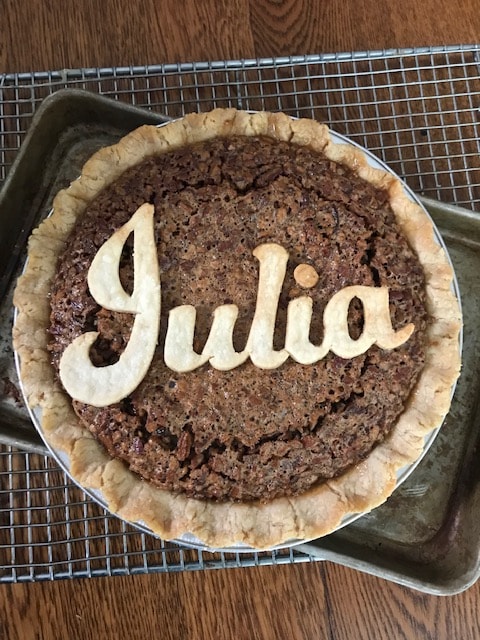 Homemade pecan pie with Julia written in pastry dough