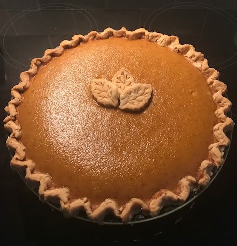 Classic pumpkin pie with decorative leaf crust